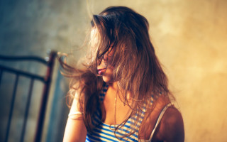 Woman longhair blowing bedroom metalrailing - a metal free wallpaper