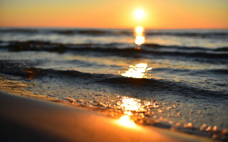 Sunset ocean wave shore bright - a sunset over the ocean free wallpaper
