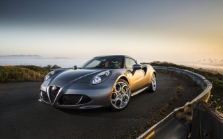Silver sports car driving hill - fog in the background free wallpaper