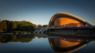 Curved roof building water trees - modernism free wallpaper