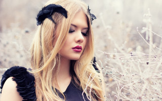 Blonde woman black dress flower 2 - a field of flowers and grass free wallpaper