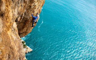 Cliff climbing man surfboard night - extreme illustration free wallpaper