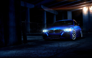 Blue car night parking lot - its headlight free wallpaper