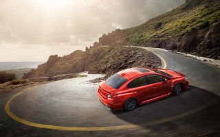 Red car ocean mountain sunset - winding free wallpaper