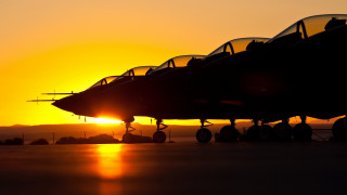 Jet fighter sunset backlit burning - the sun in the background free wallpaper