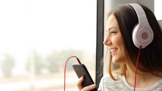 Woman headphones smiling train cellphone - headphone free wallpaper