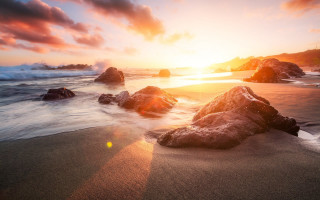 Sunset ocean rocks waves shore 2 - a sunset over the ocean free wallpaper
