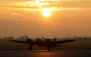 Plane takeoff sunset clouds backlit - the sun in the background free wallpaper