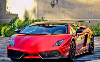 Red sports car cobblestone street 4 - a cobblestone street in front free wallpaper