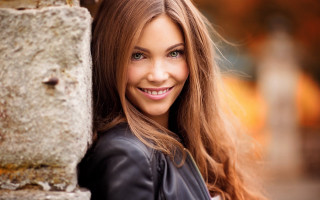 Woman longhair smiling stonewall portrait - a woman free wallpaper