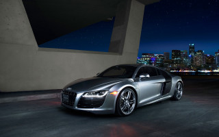 Silver car city skyline night 10 - a city skyline in the background free wallpaper
