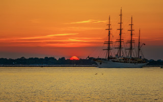 Large boat sunset water mountains - sunset free wallpaper