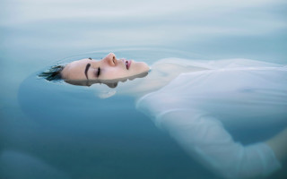 Woman floating water eyes closed - surreal photography free wallpaper