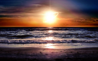 Sunset ocean wave lake mountain - a sunset over the ocean free wallpaper