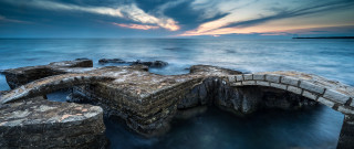 Stone bridge sunset cloudy island - a small island in the distance free wallpaper