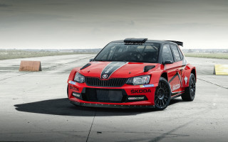 Red car black stripe runway - cloudy free wallpaper