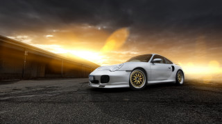 White car sunset clouds building - bernd fasching free wallpaper