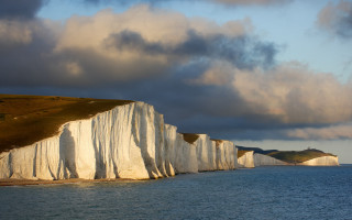 White cliff water mountain cloudy - a mountain in the distance free wallpaper
