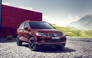 Red volkswagen suv mountains red - a red building free wallpaper