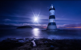 Lighthouse rocky shore night moon - a rocky shore free wallpaper