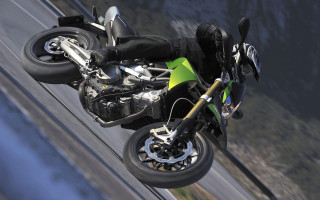 Motorcycle wheelie mountains water motion - cafer bater free wallpaper
