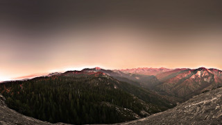 Mountain range trees cloudy sky 3 - a cloudy sky in the background free wallpaper