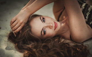 Woman laying hair air eyes - a portrait free wallpaper