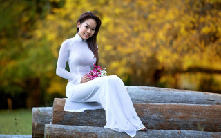 Woman white dress flowers smiling - a wooden bench free wallpaper