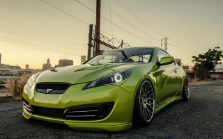 Green sports car gravel road - a green sports car free wallpaper