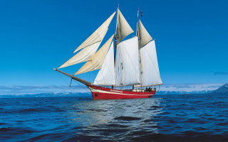 Sailboat ocean mountains blue sky - evaline ness free wallpaper