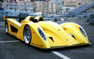 Yellow racecar cityscape night moon - a yellow race car free wallpaper