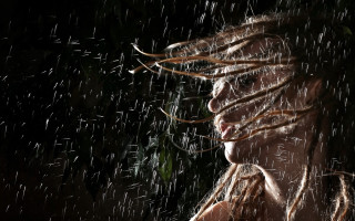 Woman dreadlocks rain wind cityscape - stormy weather free wallpaper