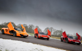 Orange sports cars snowy road - perfect symmetry free wallpaper