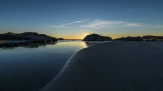 Beach rocks sunset person lake - a rock free wallpaper