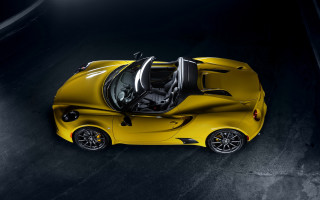 Yellow sports car above dark 2 - a yellow sports car free wallpaper