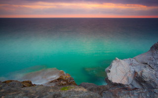 Sunset lake cliff clouds ocean - impressionist free wallpaper