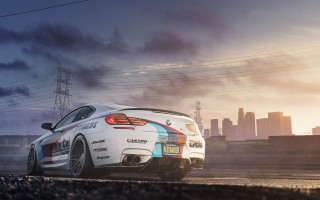White car colorful paint city 2 - a city skyline in the background free wallpaper