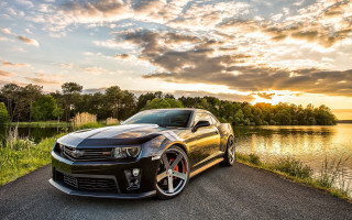 Black car lake sunset clouds - a black car free wallpaper