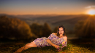 Woman dress laying flower sunset - a flower free wallpaper