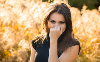 Woman covering mouth autumn fire - golden free wallpaper