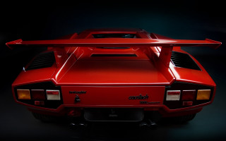 Red sports car long tailpipe - a spotlight free wallpaper