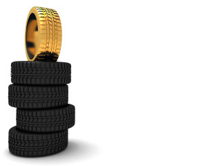 Stack of tires with gold - top of them free wallpaper