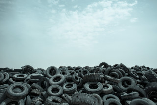 Old tires field cloudy sky - a pile free wallpaper