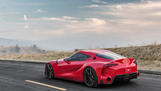Red sports car hill road - side profile free wallpaper