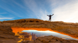 Man stand rock canyon bridge - sense of awe free wallpaper