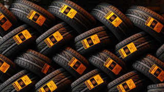 Pile of tires yellow labels - a macro photograph free wallpaper