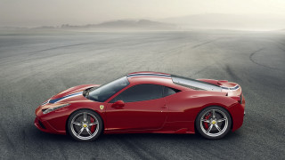 Red sports car foggy mountain - side profile free wallpaper