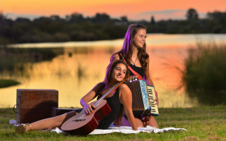 Two girls accordion lake sunset - ella guru free wallpaper
