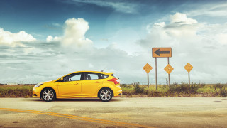 Yellow car road sign cloudy - a yellow arrow free wallpaper