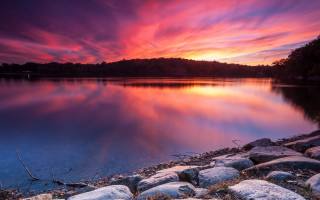 Sunset lake rocks grass mountain - colorful cloud free wallpaper